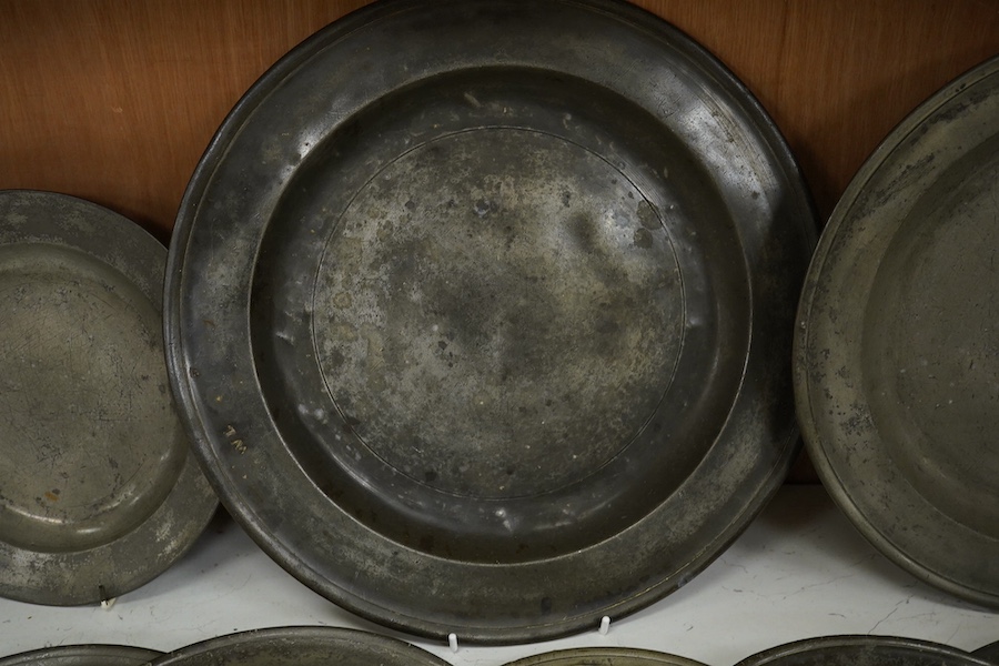 A collection of 18th and 19th century pewter plates, largest 34.5cm diameter (9). Condition - good considering age and use